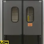 PEX‑9000 heavy-duty reinforced swing door with steel core and impact bumpers, installed in a warehouse exit to handle high-traffic and forklift impact zones