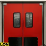 A pair of red PE-8000 industrial swinging doors installed in a clean food processing facility, designed for cold storage and thermal insulation