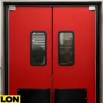 Closed red double-swing industrial door with vision panels – PE-8000 model from Paylon, designed for mid-traffic retail or warehouse environments