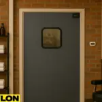Interior of a modern barbershop featuring a PE-710 Retail Swinging Door centered between exposed brick walls.