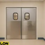 PE-620ALC retail swinging door installed in a school teacher lounge, featuring stainless steel lower panels and oval vision windows, designed to support smooth foot traffic in staff-only areas
