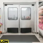 Retail Door PE-620ALC in a florist shop setting, surrounded by colorful flower displays and vibrant bouquets on both sides