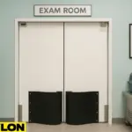 Retail Door PE-720 double-swing door installed in a veterinary clinic exam room, featuring kick plates, a clean white finish, stainless steel cages, a pet carrier, and a framed photo of a golden retriever on a mint green wall.