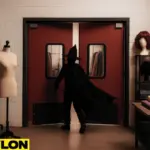 Industrial Door PE-8000 installed in a theatrical backroom with costume racks, wigs, and fabric rolls, illustrating swinging doors for cosplay studios, costume shops, and theatrical backrooms