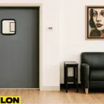 Retail Door PE-710 swinging door in a tattoo parlor, providing easy room access and maintaining client privacy, with modern décor, leather seating, and framed tattoo artwork in the background