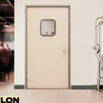 Retail Door PE-710 swinging door inside a microbrewery, separating the stainless steel brewing tanks in the production area from the rustic taproom where customers are seated at the bar.