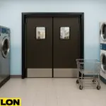 Retail Door PE-720 installed in a commercial laundromat, framed by rows of industrial washers and dryers, with a laundry cart nearby, ideal for maintaining efficient backroom access while blending seamlessly into a clean, modern laundry environment