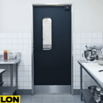 Black single restaurant swinging door with vision panel in a clean prep kitchen setups