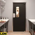 Black swinging door separating prep room from kitchen showing how to choose the right door for your backroom, breakroom, or prep area