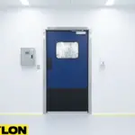 Blue industrial swinging door with stainless steel frame installed in a cleanroom or laboratory facility
