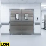 Durable aluminum double swinging doors with kick plates and vision windows shown in a commercial restaurant kitchen