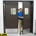 Employee walking through double swinging doors in a retail backroom with dark brown panels and vision window