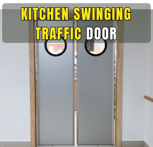 Gray PE-Series kitchen swinging traffic doors with round windows in a professional kitchen