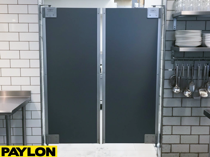 Gray double-action restaurant kitchen door installed between prep station Gray double-action restaurant kitchen door installed between prep stations