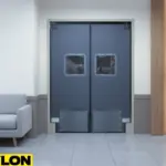 Gray swinging doors for a lounge featuring double panels, clear windows, and reinforced kick plates for durability