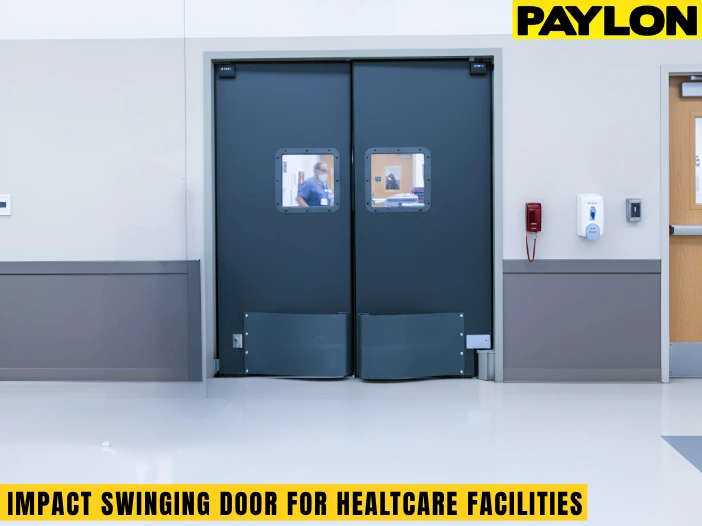 Impact swinging door installed in a healthcare facility with dual panels and stainless kick plates