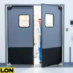 Medical staff opening gray impact swinging doors in a hospital storage room