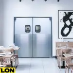 Paylon aluminum swinging doors with windows inside a contemporary restaurant