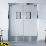 Paylon clean white aluminum swinging doors with stainless trim in elegant restaurant setting