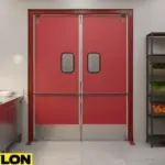 Red Swinging Kitchen Door – Red commercial swinging door with kick plate and vision panels in a professional kitchen space