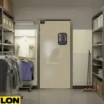 Single beige swinging door with vision panel in a retail stockroom entry