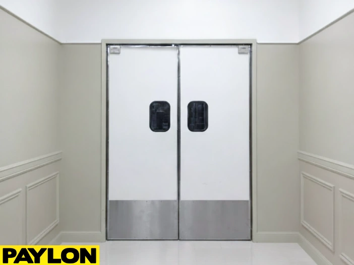 White Banquet Hall Swinging Door – Commercial white Banquet Hall Swinging Door with stainless kick plates in a neutral corridor White Banquet Hall Swinging Door – Commercial white Banquet Hall Swinging Door with stainless kick plates in a neutral corridor