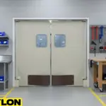 Beige industrial double doors in a maintenance workshop with organized tools and workspace setup