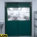 Green PVC Impact Swinging Door in commercial kitchen with clear vision panels for visibility and hygiene
