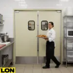 Paylon commercial kitchen swinging doors in a bakery kitchen, USA – chef-friendly design supporting hands-free, efficient movement