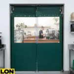 Paylon green double action swing doors installed in a café, offering clear visibility and efficient two-way operation