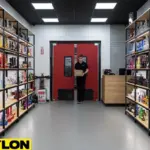 “Smoke shop interior with red PE-series swinging doors, worker carrying boxes through organized aisle.”