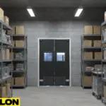 Black PE-Series swinging door in a high-density warehouse stockroom with clear pathway