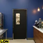 Customer-facing bake shop swinging door supporting smooth movement between counter and kitchen
