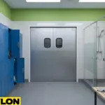 Durable silver swinging doors centered between blue lockers and glass shower partitions in a modern locker room.