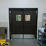 Heavy duty swinging doors used in janitor closet spaces with cleaning supply storage