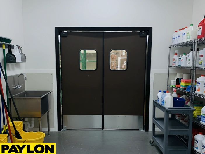 Heavy duty swinging doors used in janitor closet spaces with cleaning supply storage