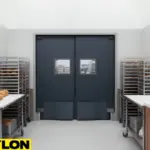 Heavy-use swinging doors in a commercial bake shop production area