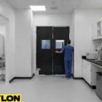 High traffic laboratory corridor with durable swinging doors for controlled movement
