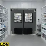 Industrial swinging doors separating clean storage areas in food processing facilities