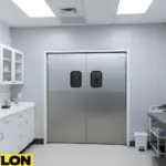Metallic double swinging doors with small vision windows inside a clean animal care workspace.