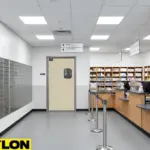 Postal office customer area with a single beige swinging door providing easy access between PO box sections and staff work zones.