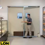 Retail swinging door installed between bakery workstations to support fast staff movement