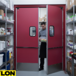 Staff member carrying food through swinging doors in a busy pantry storage area