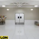 Stainless-finish PE-Series swinging doors at the center of a bright church community hall.