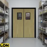 Wood-look swinging doors separating pantry storage from back-of-house work areas
