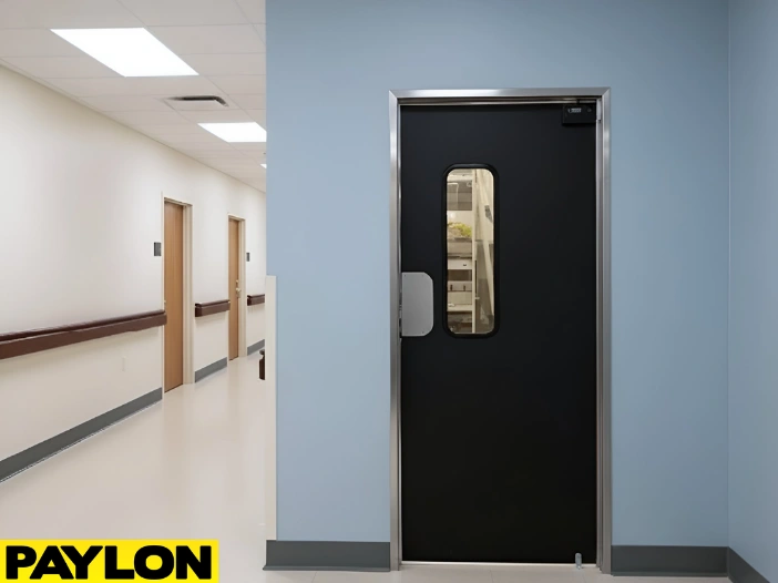 Single nursing home swinging door providing easy access between care corridors