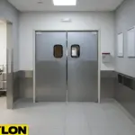 Stainless steel swinging doors separating service corridors to support frequent daily movement