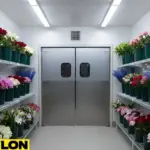 Stainless steel swinging doors used in a walk-in floral cooler for frequent access