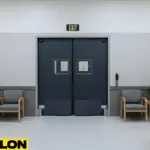 Swinging doors installed at an exhibit room exit to support controlled visitor movement