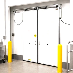 An insulated sliding door installed in a cold storage or refrigerated facility to retain cold air and maintain temperature.